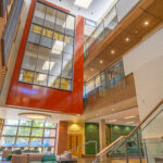 multi-level atrium with windows, walkways, dramatic stairways and gathering areas