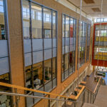 multi-level atrium with windows, walkways, dramatic stairways and gathering areas