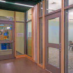 glass walled meeting rooms and entry area